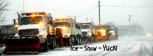 A row of snow plows ready for a winter storm