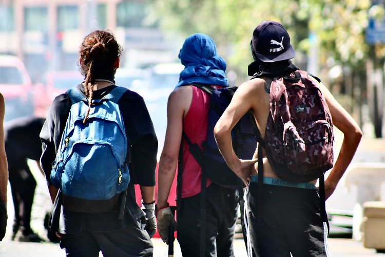 3 youth with backpacks